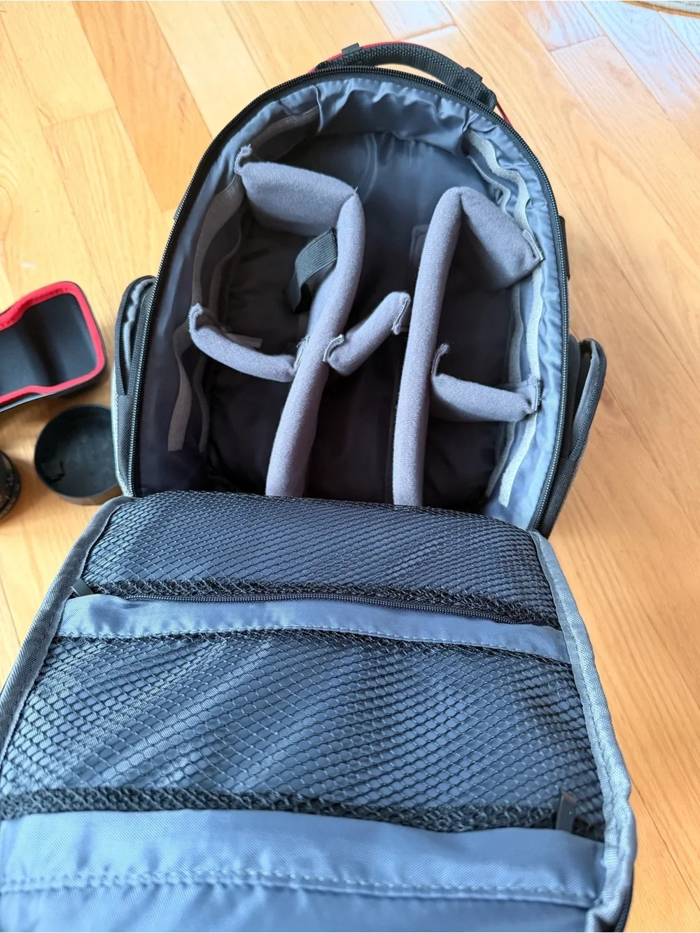 Opteka fish eye camera lens with case and camera lens organization backpack.